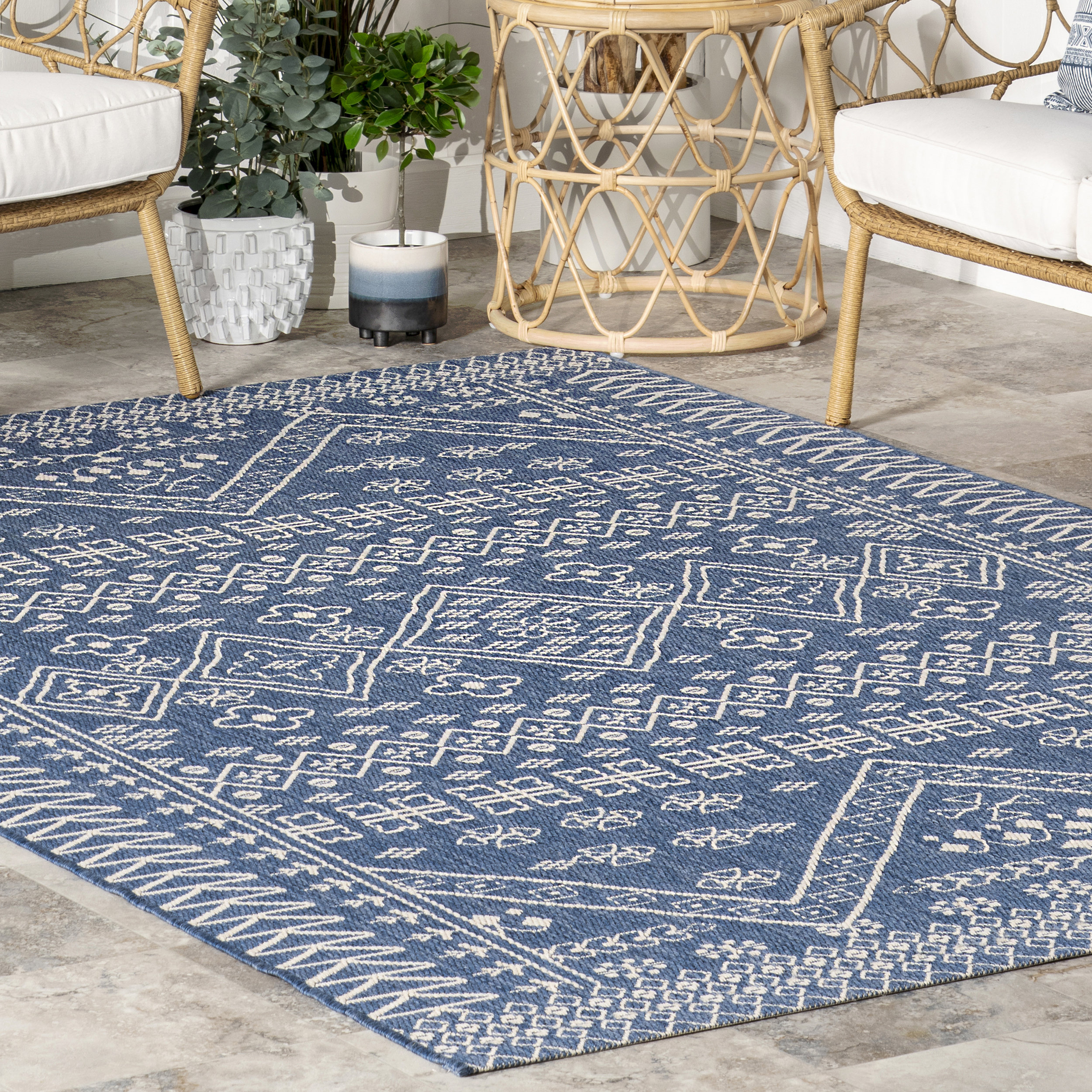 https://assets.wfcdn.com/im/01549397/compr-r85/2355/235568031/ineisha-power-loom-tribal-blue-indooroutdoor-patio-rug.jpg