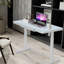 Bureau debout électrique en verre avec tiroir et charge USB - Uncage-98618126