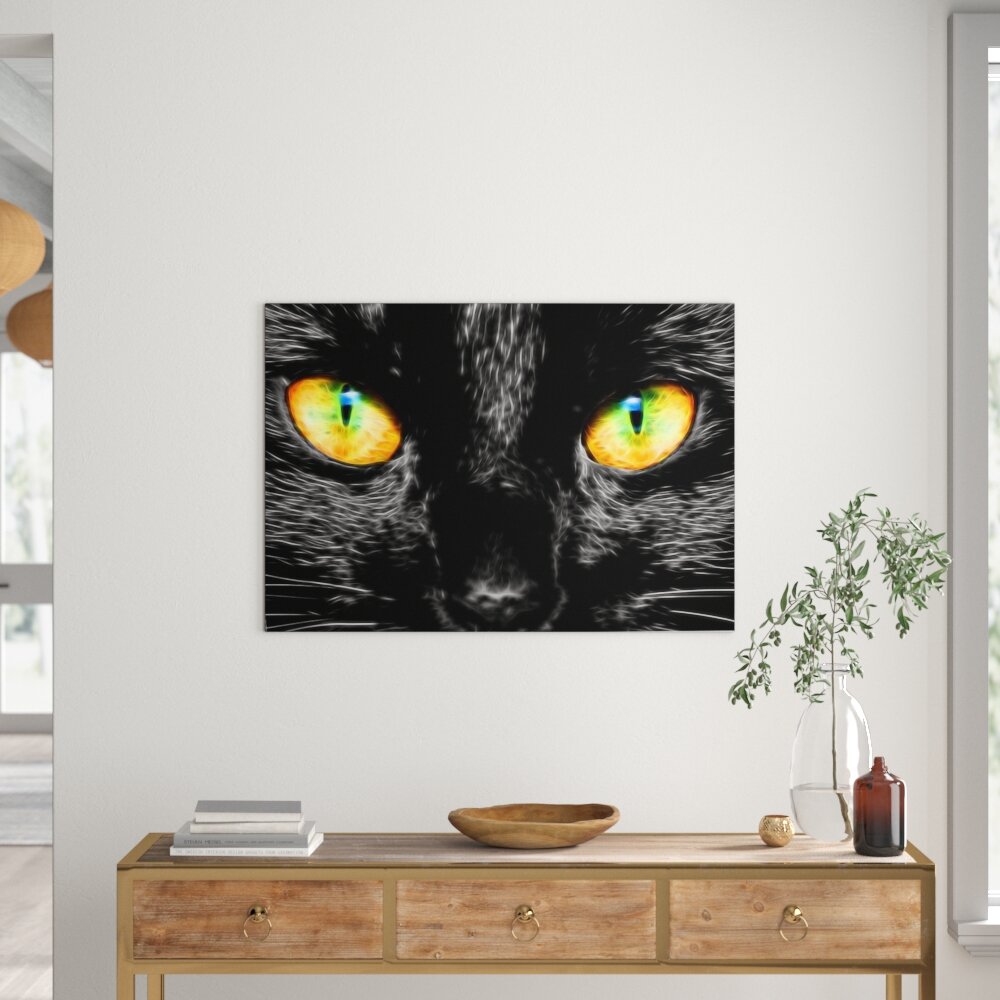 Leinwandbild Schwarze Katze mit magischen Augen