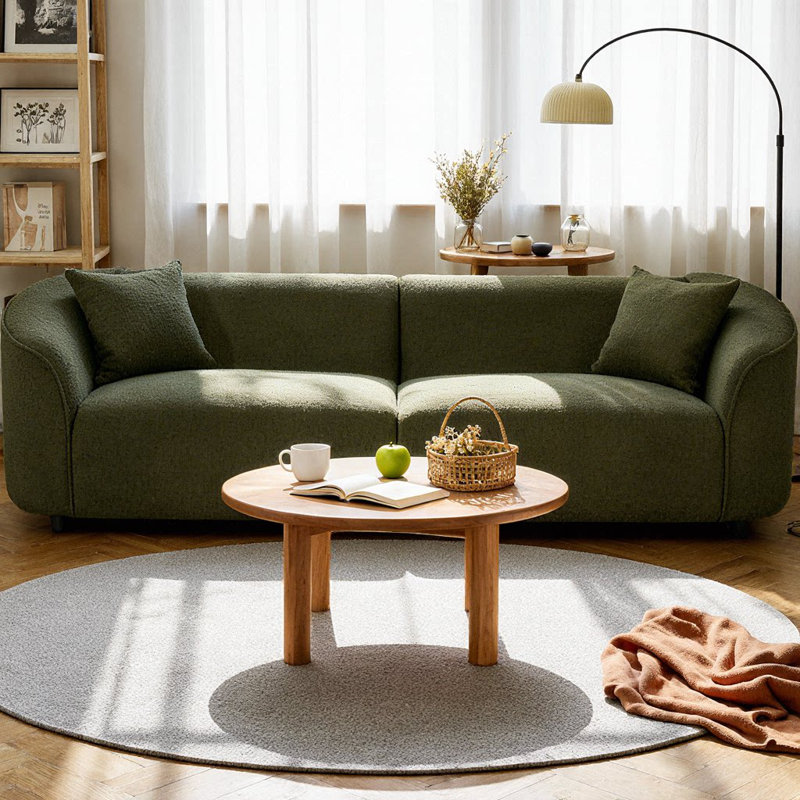Canapé 3 places contemporain incurvé Element 87" au design sculptural, revêtement en bouclé moelleux et structure en bois massif, assise ergonomique pour salon ou lounge