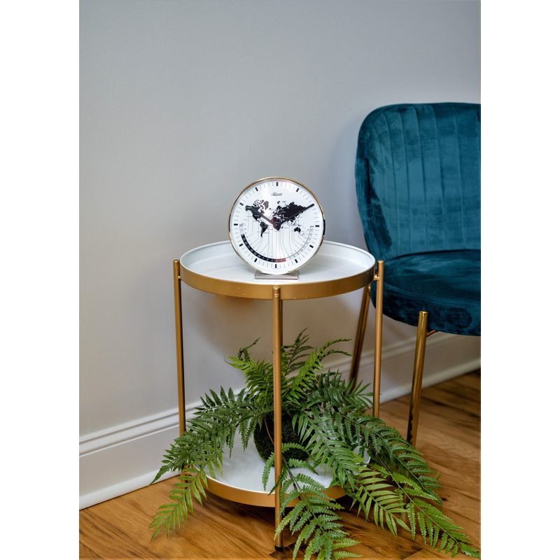 Nickel Plated Table Clock with a Quartz Time Only Movement   Dial features a world map and different time zones.