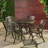 Chachere 4 - Person Patio Dining Set with Round Table
