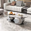 Table basse en marbre avec base sculpturale en acier inoxydable