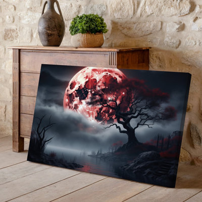 Canvas A Hauntingly Beautiful Landscape Featuring A Twisted Ancient Tree Silhouetted Wall Art Against A Massive Glowing Red Moon Canvas Wall Art