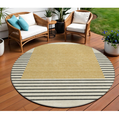 Tapis intérieur lavable rayé rond doré de 8 pi HomeRoots
