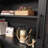 Space-Saving Hutch With Adjustable Shelves, Rattan Doors, And Integrated Cable Management For Versatile Home Use.