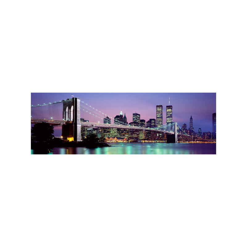 An Illuminated Brooklyn Bridge With Lower Manhattan's Financial District Skyline In The Background, New York City, New York - No Frame Panoramic Print on Canvas