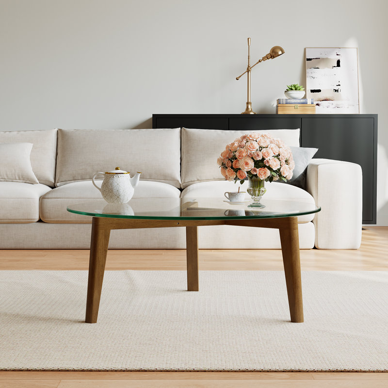 Table basse avec plateau en verre et structure en bois massif