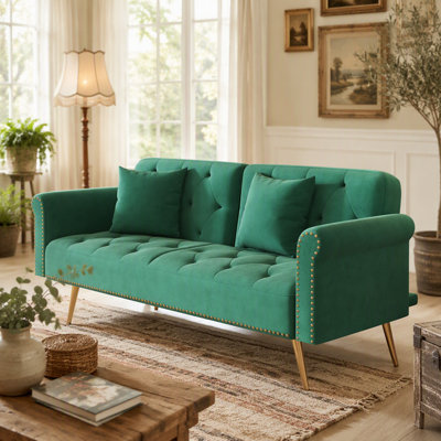 Luxurious Green Velvet Sofa Bed With Nail Head Trim And Matching Throw Pillow, Perfect For Comfort And Style