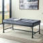 Banc d'appoint de style industriel avec structure métallique en forme de tuyau d'eau (122 cm), recouvert de velours gris et de mousse à mémoire de forme