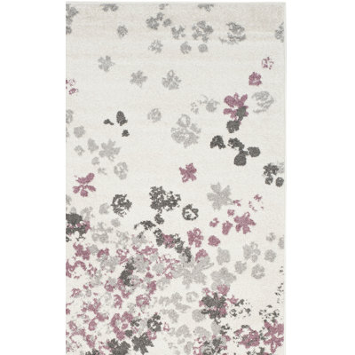 Tapis ivoire / gris / mauve à motif floral Makeba