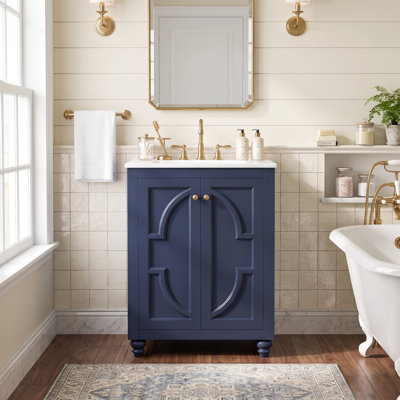 Meuble-lavabo moderne français de 24 po avec motif elliptique orné, pieds tournés en boule, structure ouverte au dos et charnières à fermeture en douceur