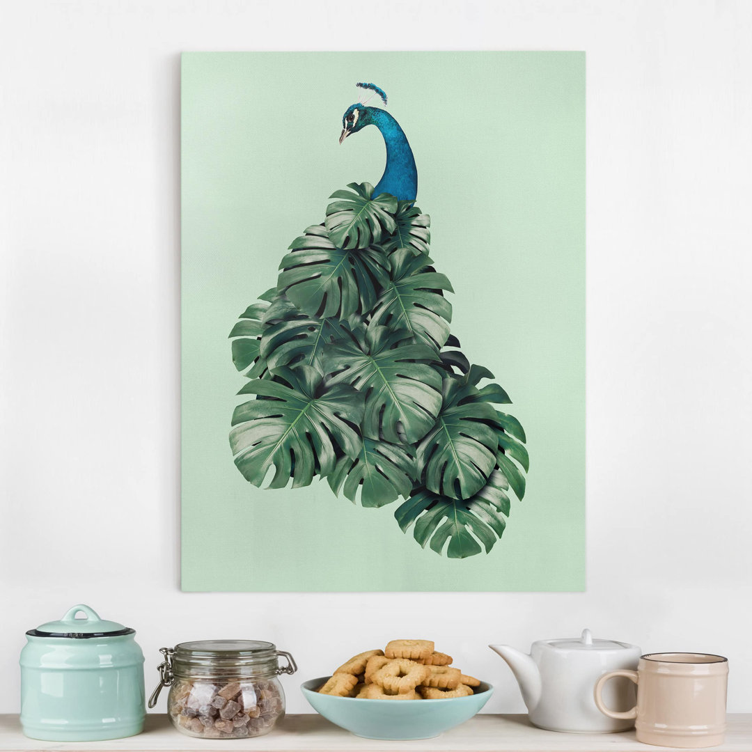 Leinwandbild Pfau mit Monstera Blättern von Jonas Loose