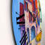 Maison avec toit rouge dans le village - horloge murale moderne-60329240