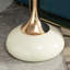 Petite table basse ronde en métal blanc avec plateforme Golden Ray