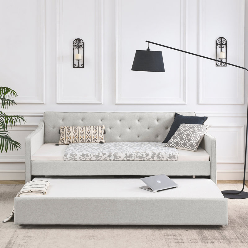 Lit de jour simple avec canapé-lit capitonné de taille simple et accoudoirs ondulés
