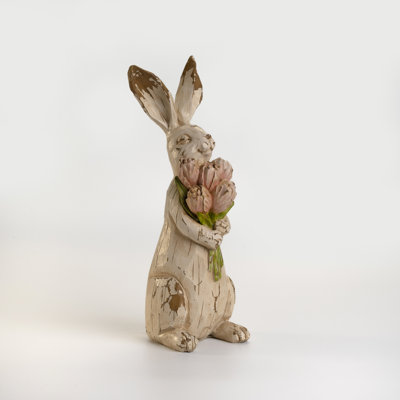 Figurine rétro en forme de lapin blanc tenant un bouquet de fleurs