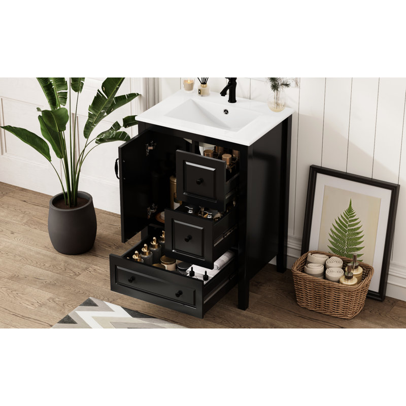 Meuble-lavabo autoportant noir de 24 po avec lavabo en céramique lisse, une porte à fermeture douce et 3 tiroirs pour articles de salle de bain