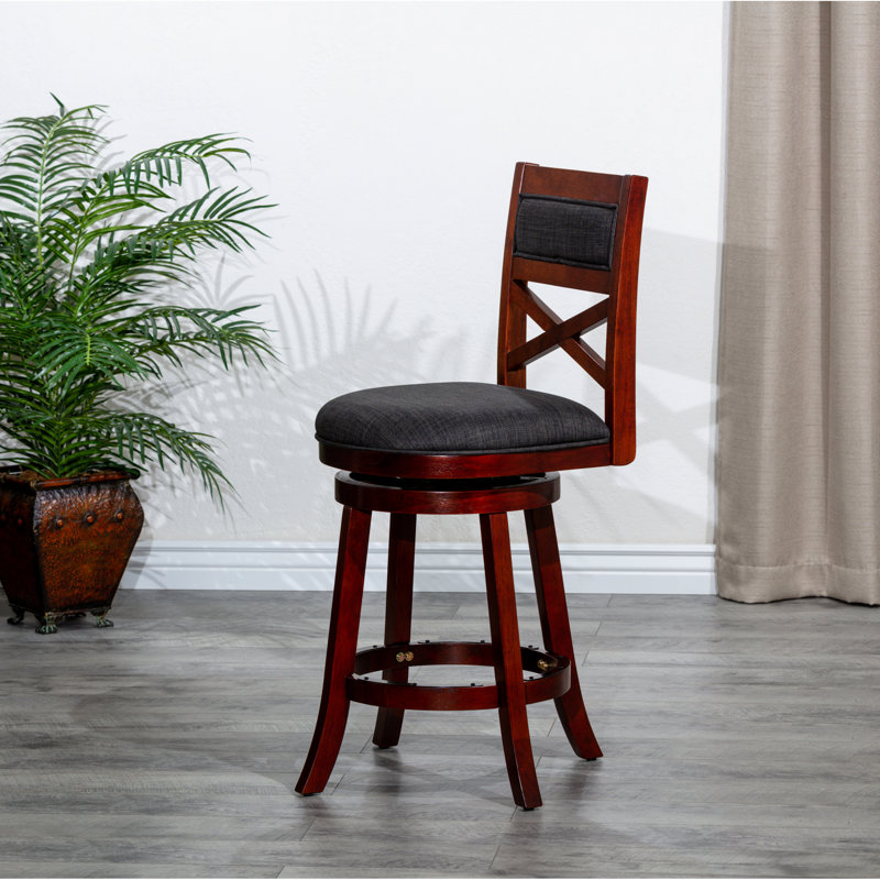 Tabouret de bar pivotant de 61 cm (24 po) avec structure stable, finition cerisier, assise en tissu anthracite. Rotation à 360 degrés. Pieds évasés en mousse confortable pour une stabilité accrue.
