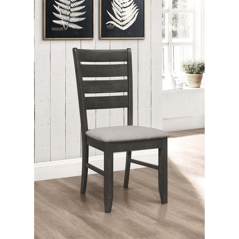 De 2 chaises de salle à manger grises foncées, tissu douillet et dossier gris, pour une expérience charmante