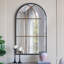 Miroir mural arqué noir et doré-770686161