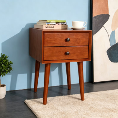Élégante table de chevet moderne avec deux tiroirs et des accents dorés, parfaite pour le rangement dans la chambre à coucher ou le salon