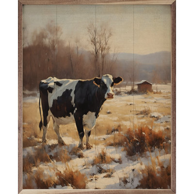 Vache laitière dans un champ enneigé