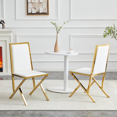 2-pack PU dining chairs with metal legs.