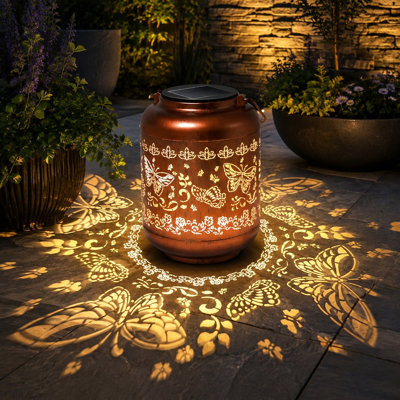 Copper metal construction and a butterfly motif define this waterproof outdoor hanging solar lantern for yard and garden ornament decor, suitable as birthday or gardening gifts for women, Mom, Grandma, or her.