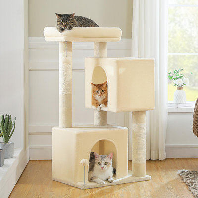 Cat tower with 2 spacious caves, thickened scratching posts, large rooftop resting area, and 2 interactive toys