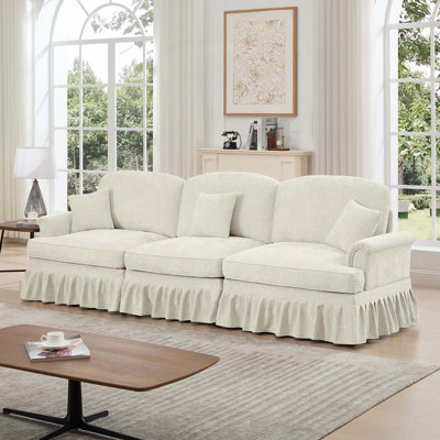 Chenille avec accoudoirs évasés et volants amovibles
