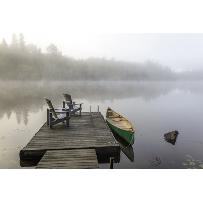 " Green Canoe And Dock On A Misty Morning " by Brianlasenby