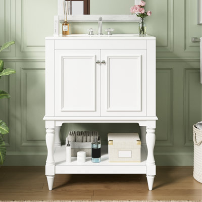 Meuble-lavabo de 24 pouces avec lavabo en céramique, pieds d'armoire de style rétro, dossier ouvert pré-percé pour installation et travaux de plomberie modernes.