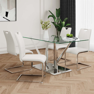 Table de salle à manger en verre de style moderne avec un design transparent, une base robuste en acier inoxydable et des chaises blanches pour un repas élégant (ensemble de 5)
