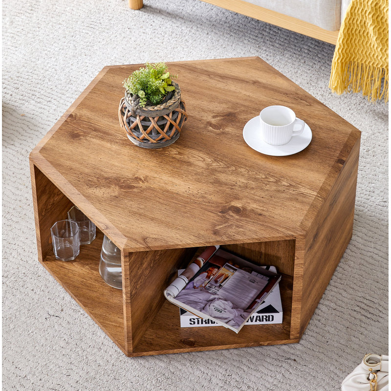 Table basse hexagonale en panneau de fibres à densité moyenne, autocollants à motif de grain de bois caractéristiques, conception à trous multiples pour donner plus d'espace de rangement, conception simple et pratique qui la rend idéale pour toutes 