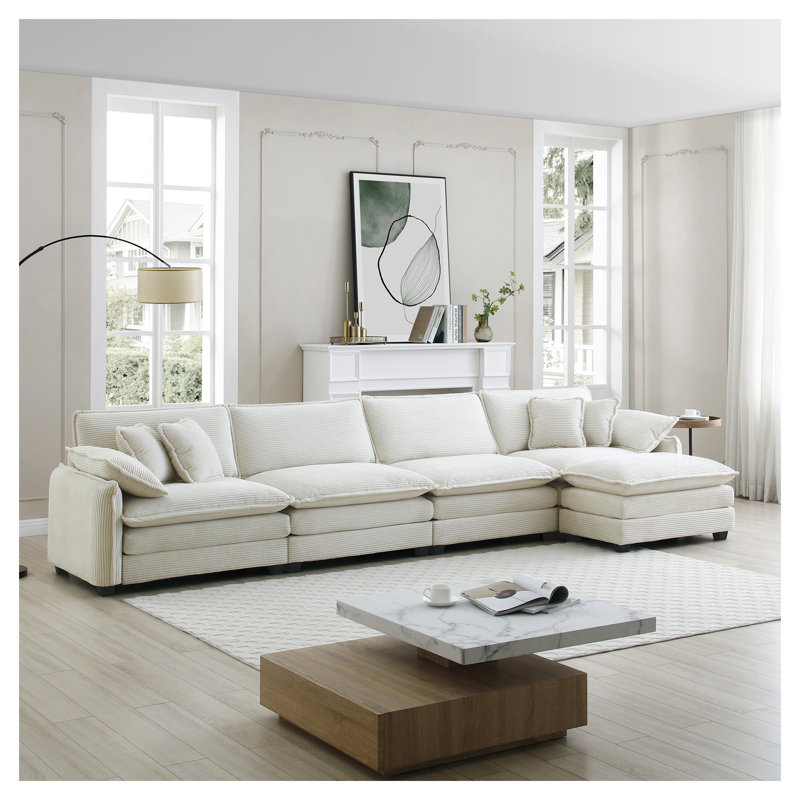 Canapé modulaire beige moderne en velours côtelé 4 places avec repose-pieds et coussins décoratifs pour le salon