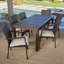 Aaruhi 6 - Person Acacia Wicker Patio Dining Set with Rectangular Table