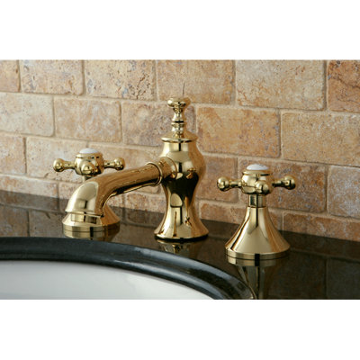 Kingston Brass English Country Two-Handle 3-Hole Deck Mount Widespread Bathroom Faucet with Brass Pop-Up Drain