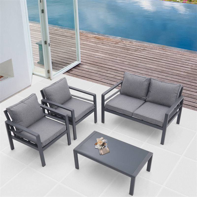 Ensemble de patio extérieur 4 pièces toutes saisons avec coussins confortables et table basse robuste pour divers espaces