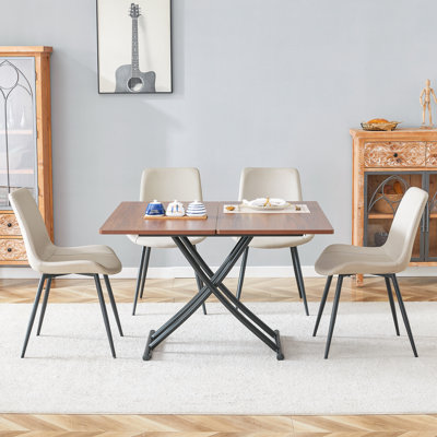 Ensemble de table de salle à manger multifonctionnel à finition en bois aggloméré et pieds en métal noir avec 4 chaises en cuir PU pour la vie moderne, la salle à manger et les espaces d'étude