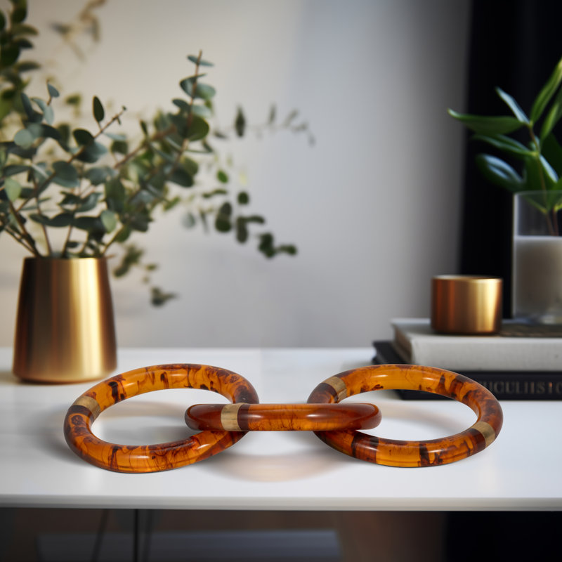 Glam Polyresin Decorative Object with Linked Ring Design and Luxe Brass Accents for Modern Style and Eye-Catching Versatile Display in Contemporary and Transitional Interiors