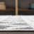 Michela High-Low Pile Knotted Trellis Geometric Black/Ivory Indoor/Outdoor Rug-607497379