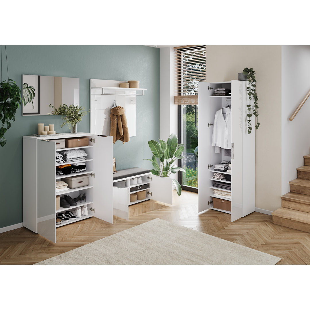The Aliaya shoe cabinet is white and measures 87cm W x 120cm H x 40cm D.