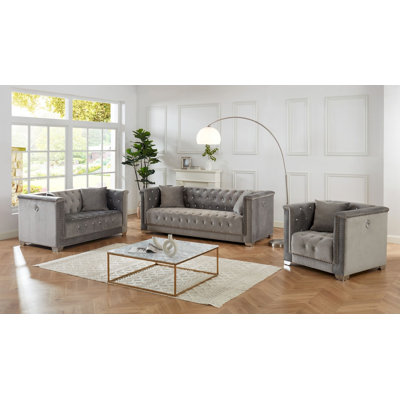 Causeuse capitonnée en velours gris
