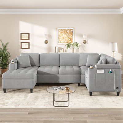 Canapé modulaire moderne en forme de U avec porte-gobelets intégrés, rangement et ports de chargement USB pour un confort ultime dans votre salon.