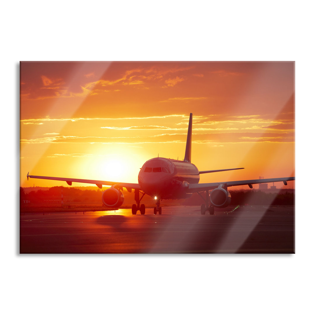 Glasbild Flugzeug im Sonnenuntergang