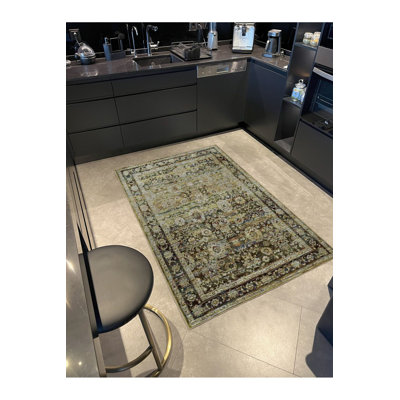 Tapis vert tissé à motif géométrique traditionnel