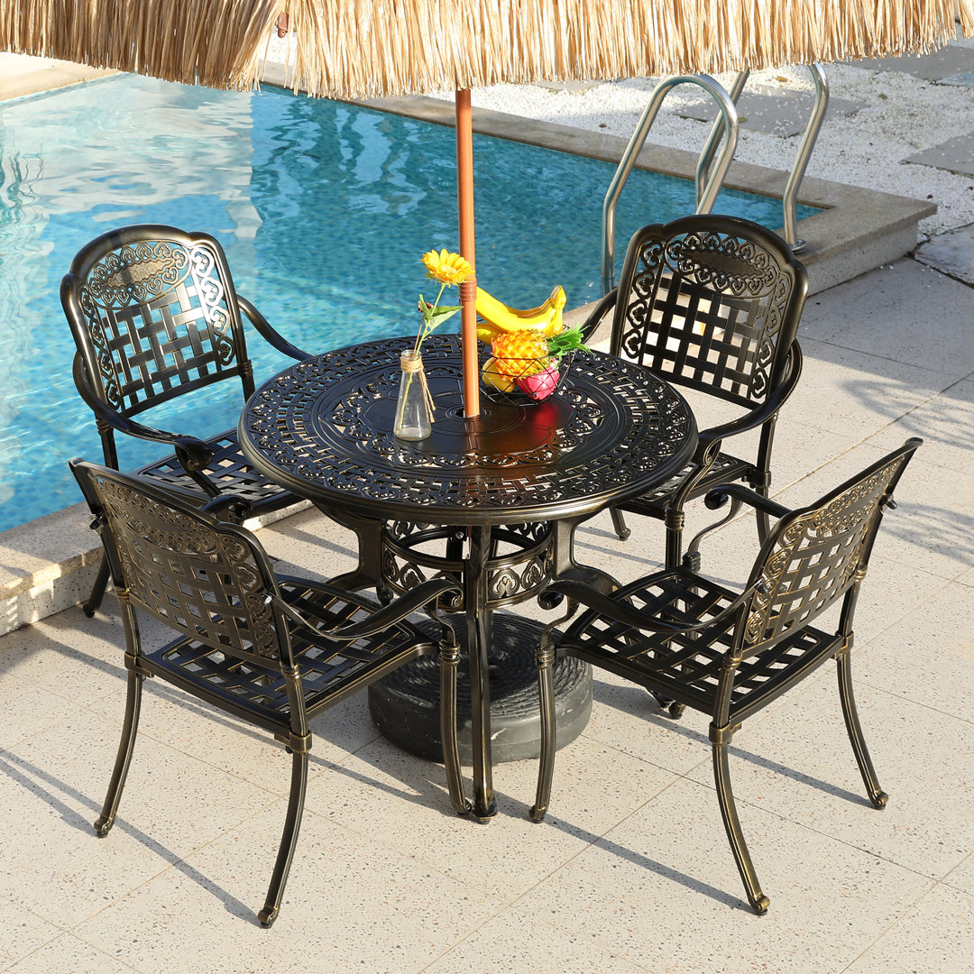 Southview 4 - Person Metal Patio Dining Set with Round Table Bloomsbury Market
