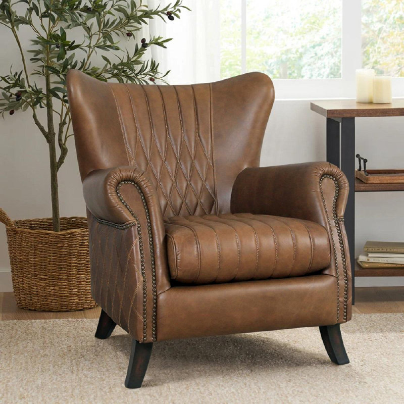 Fauteuil à oreilles en cuir Vicenza