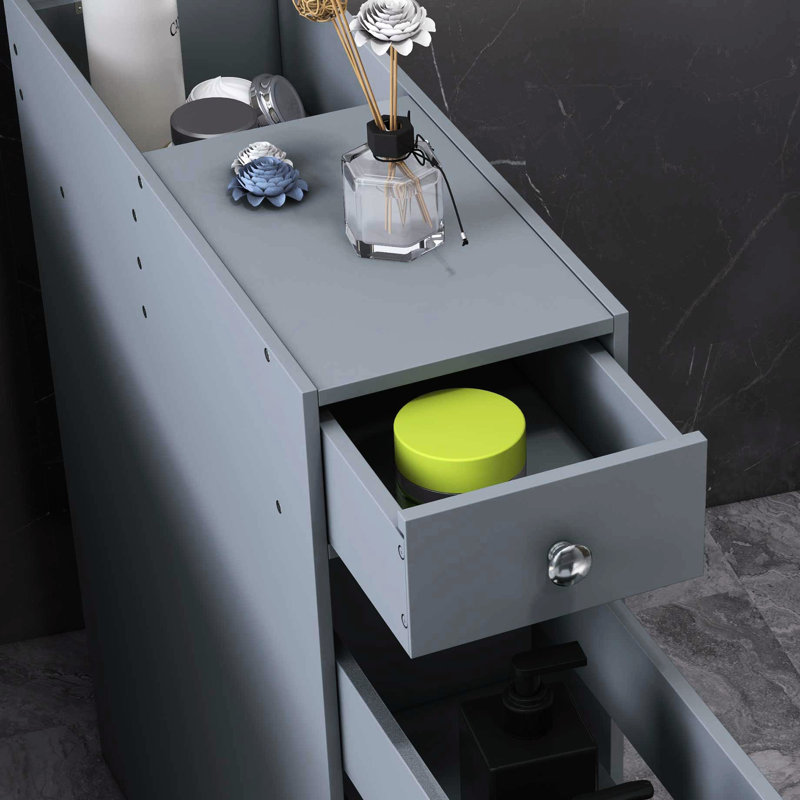 Rangement étroit pour salle de bain - gris. Armoire moderne avec beaucoup d'espace. Tiroirs cachés. Qualité et économie d'espace. Peut contenir des articles de toilette.